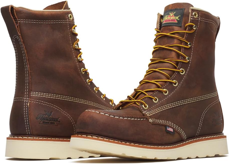 Brown lace-up 8-inch work boots, padded collar, contrast stitching, thick rubber sole.